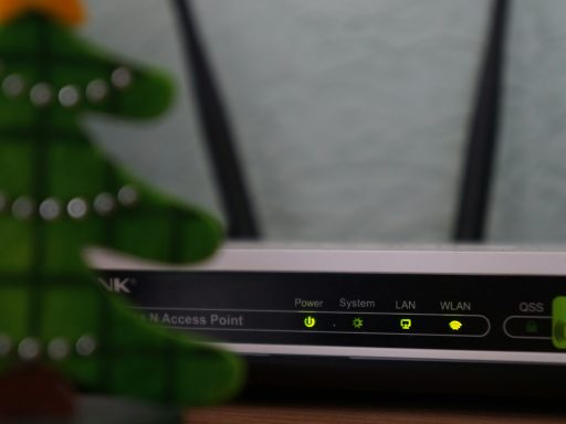 white and black modem router with four lights